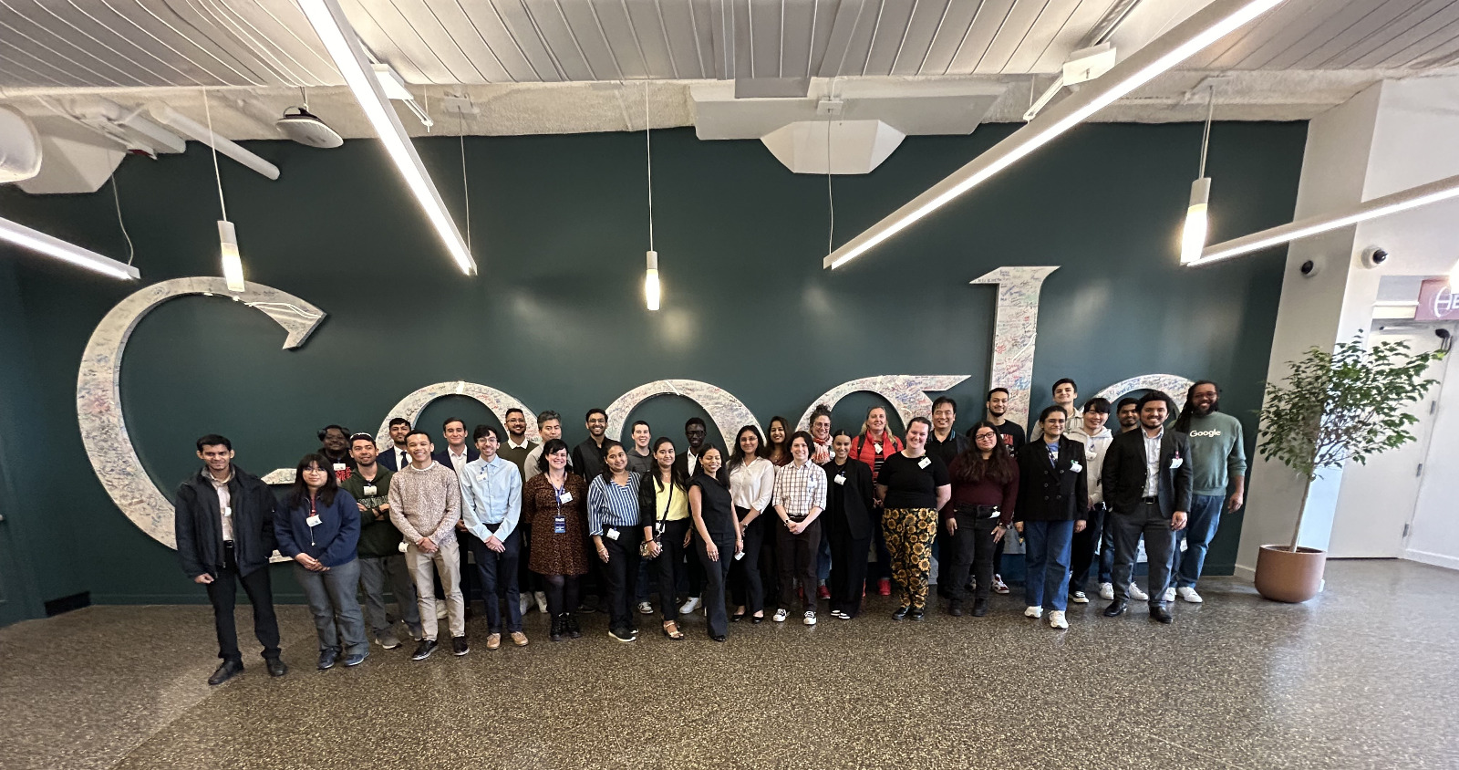 Group photograph at the Google wall