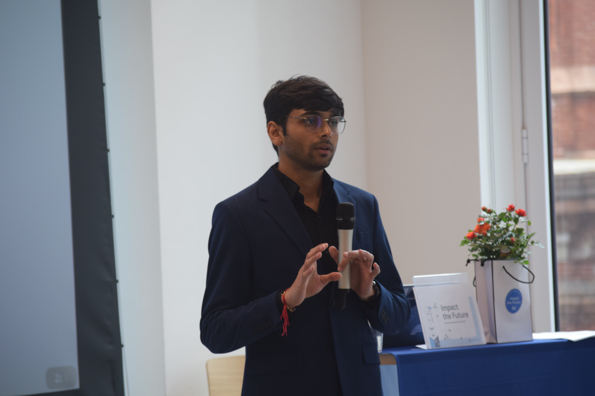 Om Gaikhe speaking at a presentation
